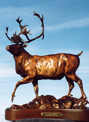 Bronze sculpture of a caribou bull.
