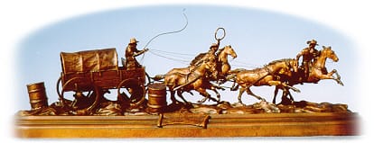 Bronze sculpture of chuckwagon team racing.