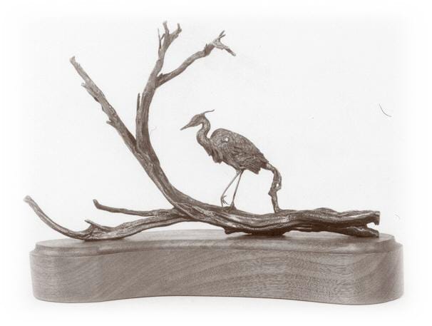 Bronze sculpture of a great blue heron.