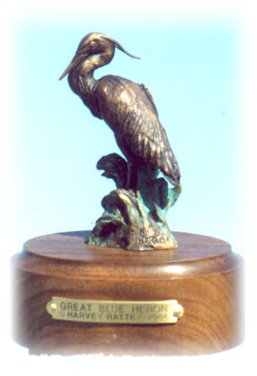Bronze sculpture of great blue heron.