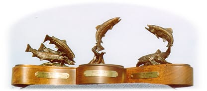 Three different fish sculptures.