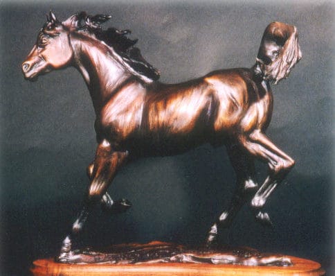 Bronze sculpture of a beautiful bay Arabian horse.