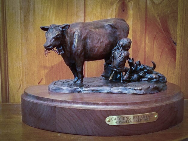 bronze sculpture of a little girl with cats and a milk cow